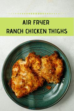 an air fryer ranch chicken thighs on a green plate with the title above it