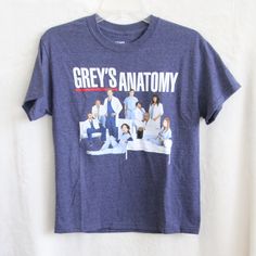 a grey's anatomy t - shirt hanging on a wall