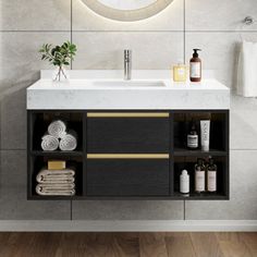 a bathroom with a sink, mirror and towel rack