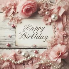 a happy birthday card with pink flowers and pearls