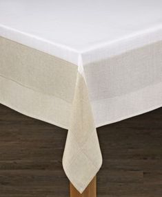 a white table cloth on top of a wooden table