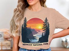 Embrace the beauty of Redwood National Park with this vintage-style t-shirt. Featuring a stunning retro sunset, this tee is perfect for nature lovers and outdoor enthusiasts. Whether you're hiking, camping, or simply enjoying a casual day out, this shirt is a great way to showcase your love for adventure and the great outdoors. It's also an ideal gift for friends and family who cherish national parks and wilderness exploration. Experience the awe-inspiring landscapes of Redwood National Park every time you wear this unique and eye-catching t-shirt. Vintage National Park, Inspiring Landscapes, National Park Shirt, Redwood National Park, Retro Sunset, Adventure Shirt, Sweatshirt Vintage, Gifts For Nature Lovers, Nature Lovers