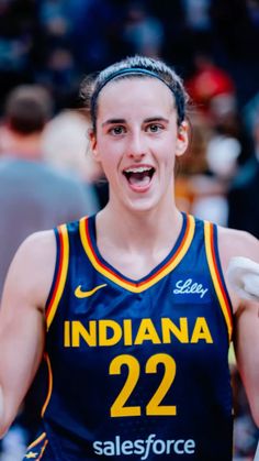 a female basketball player is excited about her team's win