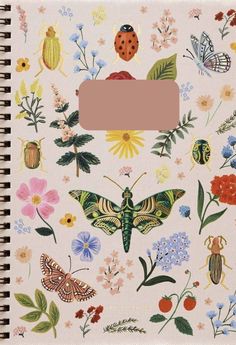 a notebook with flowers and bugs on it