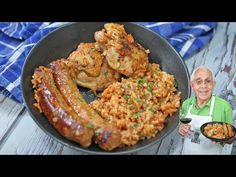 an old man holding a plate with food on it