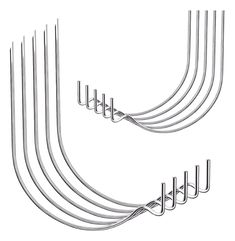 a set of six metal hooks on a white background