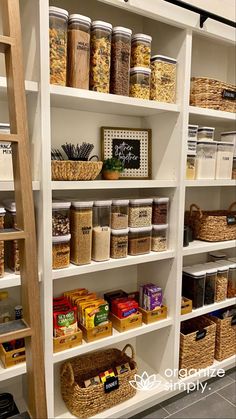 the shelves are filled with various types of food and baskets on them, including cereals