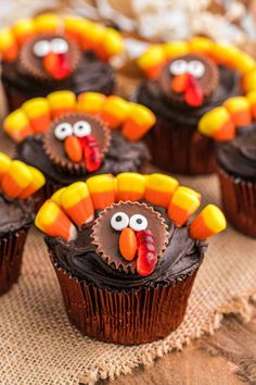 cupcakes with chocolate frosting decorated like turkeys