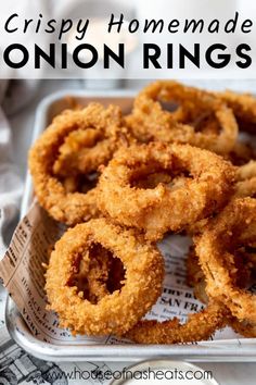 crispy homemade onion rings in a tray with text overlay that reads crispy homemade onion rings