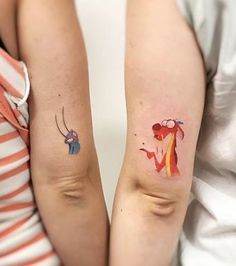 two people with matching tattoos on their arms