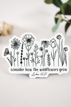 a sticker with flowers and the words consider how the wildflowers grow on it