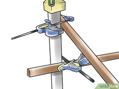 a wooden pole with tools attached to it and two pieces of wood sticking out of the top