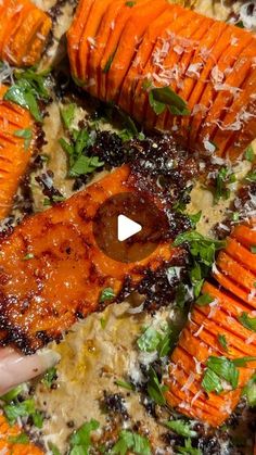 someone is cooking carrots with parmesan cheese and herbs on the top one