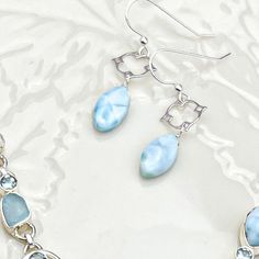 Larimar is my newest obsession, and I feel a clean look of it in a simple setting is all the grammar this gemstone needs. I have these Larimar marquee gems custom cut for me and I added them oupside this stunning filigree frame. Gems measure 15mm and earrings drape at almost 1.5”. I just love how their turned out. Wear them dolor or with any of my other Larimar pieces like this Statement Pendant Style Larimar necklace or Elegant Pendant Style Larimar Necklace Or with a classic Katie rosary in pe Elegant Handmade Larimar Jewelry, Elegant Larimar Dangle Earrings, Elegant Larimar Jewelry For Formal Events, Filigree Frame, Rosary Jewelry, Larimar Necklace, Pearl Rosary, Classic Earrings, Elegant Pendant