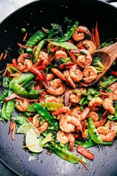 stir fry with shrimp and vegetables in a wok