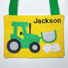 a green and yellow bag with a tractor on it