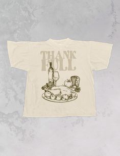 Show off your love for everyone's most thankful Holiday, Thanksgiving, in this cozy oversized tee!- Features a Thanksgiving dinner in brown ink with the words "Thank-Full" in a tan ink- Screen print transfer that is individually heat pressed onto each tshirt- Super soft, vintage wash t-shirt that gets softer with each wash- 100% Cotton- Oversized fit- Sizing translation: XS/S - L , S/M - XL , L/XL - 2XL , 2XL/3XL - 3XL**due to screens & filters color may vary from pictures** Oversized Brown T-shirt For Fall, Vintage Relaxed Fit T-shirt For Fall, Oversized Fall Slogan T-shirt, Oversized Slogan T-shirt For Fall, Brown Graphic Print T-shirt For Fall, Vintage Text Print T-shirt For Fall, Vintage Slogan T-shirt For Fall, Thanksgiving Graphic Print Crew Neck T-shirt, Screen Print Transfer