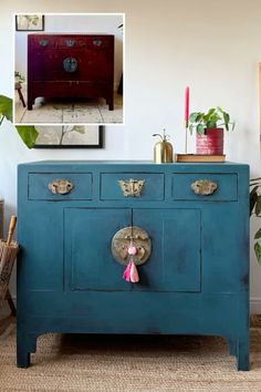 a blue cabinet with two drawers and a pink tassell on top, in front of a white wall