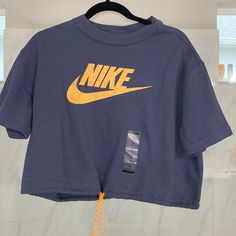 Nike Oversized Drawstring At The Bottom Crop Top New Relaxed Fit Drawstring Tops For Streetwear, Drawstring Crew Neck Streetwear Top, Casual Crew Neck Top With Drawstring, Cotton Drawstring Crew Neck Top, Cotton Crew Neck Top With Drawstring, Relaxed Fit Crew Neck Top With Drawstring, Casual Blue Top With Drawstring, Blue Cotton Drawstring Tops, Nike Women Outfits