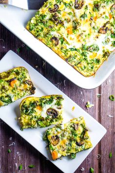 a casserole dish with broccoli, cheese and mushrooms in it on a white plate