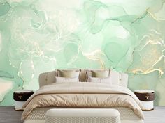 a large bed sitting in front of a wall with green paint on it's walls