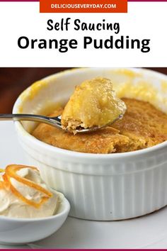 an orange pudding in a white bowl with a spoon full of cream on top and the words self saucing orange pudding above it