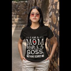 This mom,wife and boss tshirt is perfect for the strong, independent and multitasking woman who juggles it all!  This funny tshirt features a funny and relatable statement that is sure to resonate with any woman who wears many hats and manages it all with ease.  This cool tshirt is made from high-quality and soft material, making it comfortable to wear all day.  The bold and graphic text is printed on the shirt that will not fade easily.  This womens tshirt is a great way to show off your appreciation for the amazing women in your life, whether it be your mom, wife, or boss.  It also makes a perfect gift for any occasion, for the woman who is always on the go and balances it all.  Show off your sense of humor and your appreciation for the strong women in your life by getting your hands on Multitasking Woman, Black T-shirt With Funny Text For Mother's Day, Funny Black T-shirt For Mother's Day, Cheap Funny T-shirt For Mother's Day, Funny Graphic Print T-shirt For Mother's Day, Boss Tshirt, Pink Funny Print T-shirt For Mother's Day, Best Gift For Mom, Best Gift For Wife