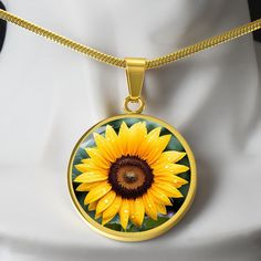 Unique Personalized Sunflower Necklace!   ➜ Add a touch of sophistication and individuality to your style with our Personalized Stainless Steel and 18k Yellow Gold Finish Sunflower Necklace. This stunning necklace combines sleek stainless steel with a luxurious 18k yellow gold finish to create a modern and eye-catching accessory that will make heads turn.  This Sunflower Pendant Is the Perfect Keepsake! Whether for Yourself or a Loved One. ➜ Each necklace is meticulously crafted with high-quality stainless steel and shatterproof liquid glass coating, ensuring durability and a polished, contemporary look. The radiant 18k yellow gold finish adds a vibrant pop of color, making this necklace a true statement piece that reflects your unique personality. But the magic doesn't stop there! Take ad Sunflower Pendant Gold, Sunflower Jewelry, Sunflower Gifts, Sunflower Pendant, Sunflower Necklace, Women Flower, Color Making, Glass Coating, Luxury Necklace