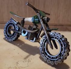 a toy motorcycle made out of metal parts