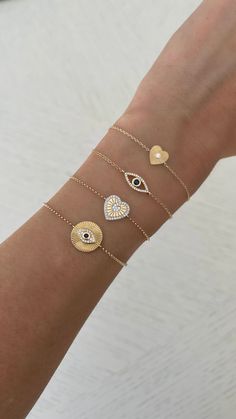 This beautiful bracelet features 1 fluted heart with a diamond center stone. Looks great alone or stacked with other bracelets! Available in 14K Yellow, White or Rose Gold Heart measurement: 7mm Diamond: 0.15tcw Back of heart is fluted too (no diamond) FINAL SALE Sapphire Eyes, Rose Gold Heart, Eye Bracelet, Yellow Gold Chain, Evil Eye Bracelet, Gorgeous Bracelet, Gold Heart, Heart Bracelet, Diamond Heart