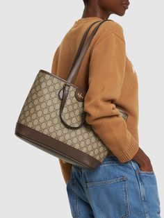 Height: 25cm Width: 31cm Depth: 13cm. Strap drop: 28.5cm. Top handle drop: 12cm. Double fixed straps. Double top handles. Logo details. All over pattern placement may vary. Gold-colored metal hardware. Leather trim. Cotton & linen lining Gucci Top Handle Shoulder Bag For Shopping, Gucci Double Handle Satchel For Shopping, Gucci Tote Satchel For Shopping, Elegant Handheld Monogram Canvas Bag, Gucci Shoulder Bag Satchel For Daily Use, Gucci Shoulder Tote Bag, Gucci Satchel With Detachable Strap For Shopping, Gucci Formal Handheld Shoulder Bag, Gucci Handheld Shoulder Bag For Formal Occasions