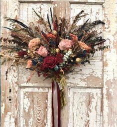 a bouquet of flowers sitting on top of a door