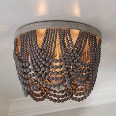 a chandelier with beads hanging from the ceiling