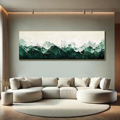 a living room with a large painting on the wall and a white couch in front of it