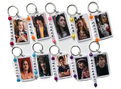 a bunch of key chains with pictures on them