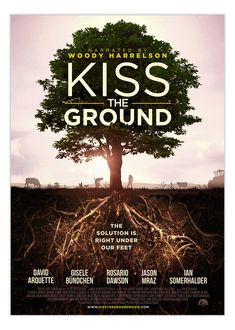 the poster for kiss the ground, starring in which two people are standing under a tree