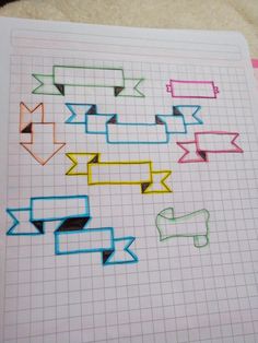 a piece of paper with colored arrows drawn on it