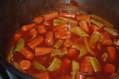 carrots and celery cooking in a pot on the stove