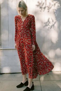 This is a deadstock crepe found in los angeles ca. it has a nice drape and features a candy red ground with a small floral ditsy print throughout.    the lupine maxi dress is a blousey dress style that drapes around the bust and waist with a long ruffle skirt shell buttons at center front & cuffs and ties at the waist for an adjustable fit.    madeline is 5'8" and wearing a size small    deadstock cottons & shell buttons on front. dry clean to protect our planet's forgotten materials. Long Ruffle Skirt, Candy Red, Ditsy Print, Denim Hat, Red Candy, Shell Buttons, Dress Inspiration, Quilted Coat, Engineered Garments