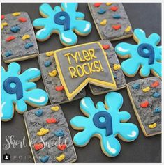 decorated cookies are arranged in the shape of flowers and letters that say tyler rocks on them