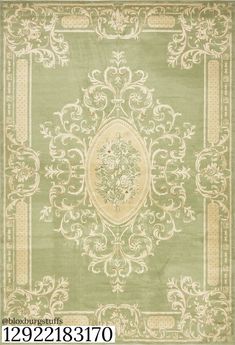 a green rug with an ornate design on it