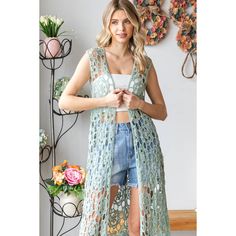 This cardigan is crafted with a crochet knit, making it a unique and versatile addition to your wardrobe. Its sleeveless design coupled with a deep V-neck and open front create a flattering silhouette. With its full body length and elegant sage color, this imported piece adds a touch of sophistication to any outfit. Hand wash only. Bohemian V-neck Vest For Spring, Spring Sleeveless Open Knit Vest, Spring V-neck Crochet Top With Open Knit, Spring V-neck Crochet Top For Layering, Spring Open Knit Vest For Layering, Knit Beach Vest For Spring, Spring V-neck Crochet Top, Spring Beach Knit Vest, Summer V-neck Cardigan Vest