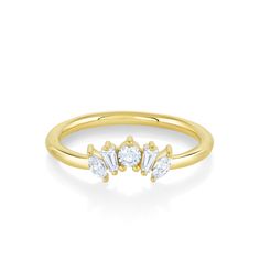 a gold ring with three stones on the top and two small diamonds on the bottom