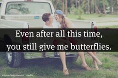 two people sitting in the back of a pick up truck with a quote on it that says, even after all this time, you still give me butterflies