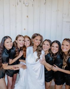 a group of beautiful women standing next to each other