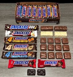 chocolate candy bars are arranged on a table