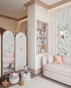 a living room filled with white furniture and walls covered in wallpapered plants on it