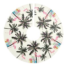 a white plate with palm trees and flamingos on it