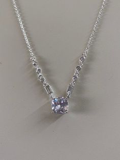 This silver and cubic zirconia necklace has a length of 16.5 inches.   It is elegant and in excellent  condition.  The center cubic zirconia stone is 2ct. in size.  This   NYC necklace  also has six smaller round cubic zirconias  and two emerald cut zirconia cascading donwn the chain. Corning Ny, Victorian Pendants, Zirconia Necklace, Cubic Zirconia Necklace, Jewelry Maker, Emerald Cut, Pendant Necklaces, Necklace Etsy, Jewelry Necklace Pendant