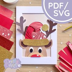 a card with a reindeer's hat on it next to some crafting supplies